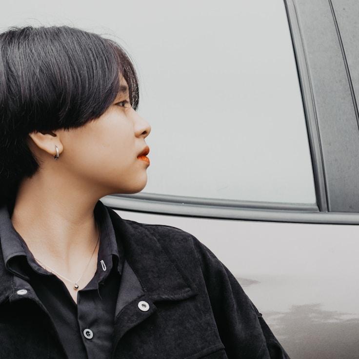 Aanya Kapoor, Lead Design Curator at SoftValleyApple, reviewing corporate floral arrangements